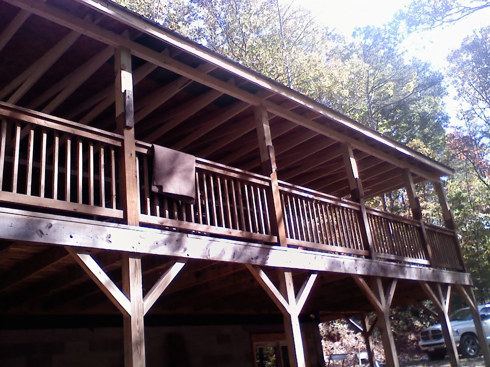 Timber framing under a new elevated porch and deck — Roof Leak Repair in Absaraka by Roofing Brothers